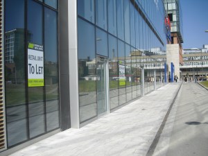 More empty shop units on the way to Tesco's entrance. They do not signal that this is a place to linger in after the shopping's done